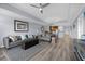 Living Room with hardwood floors, gray sofas and large windows at 7662 Whisper Way # 402, Reunion, FL 34747