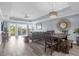 Spacious living room with hardwood floors and access to balcony at 7662 Whisper Way # 402, Reunion, FL 34747