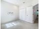 Well-lit bedroom with double doors, wall-to-wall carpet and ceiling fan at 8150 Serenity Spring Dr, Windermere, FL 34786