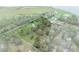 Aerial view of waterfront property with a barn at 965 Keen Rd, Frostproof, FL 33843