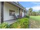 Inviting front porch with rocking chairs, showcasing the home's exterior at 965 Keen Rd, Frostproof, FL 33843