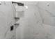 Shower with marble tile and black fixtures at 965 Keen Rd, Frostproof, FL 33843