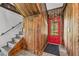 Entryway with wooden staircase and red door at 965 Keen Rd, Frostproof, FL 33843