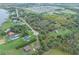 Rural property with homes, a lake, and green spaces at 965 Keen Rd, Frostproof, FL 33843