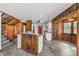 Modern kitchen with island and wood-paneled walls at 965 Keen Rd, Frostproof, FL 33843