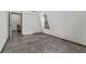 Upstairs bedroom with sloped ceiling, tile floors and access to upper hallway at 965 Keen Rd, Frostproof, FL 33843