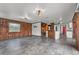 Bright living room with tile floors, open kitchen, and view of the staircase at 965 Keen Rd, Frostproof, FL 33843