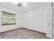 Simple bedroom with tile floor and large window at 965 Keen Rd, Frostproof, FL 33843