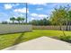 Spacious backyard with a large grassy area and a patio at 3550 Davenport Creek Ct, Kissimmee, FL 34746