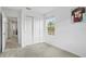 Spacious bedroom with a large window and double door closet at 3550 Davenport Creek Ct, Kissimmee, FL 34746