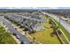Aerial view of community, showcasing townhomes at 3550 Davenport Creek Ct, Kissimmee, FL 34746