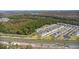 Aerial view of townhome community near wooded area at 3550 Davenport Creek Ct, Kissimmee, FL 34746