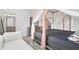 Bedroom with a canopy bed and access to the en-suite bathroom at 3550 Davenport Creek Ct, Kissimmee, FL 34746