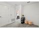 Bright hallway with carpet, two doors, and a view into a bedroom at 3550 Davenport Creek Ct, Kissimmee, FL 34746
