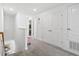 Upstairs hallway with light gray carpet and access to bedrooms at 3550 Davenport Creek Ct, Kissimmee, FL 34746