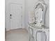 Modern entryway with white door and decorative console table at 3550 Davenport Creek Ct, Kissimmee, FL 34746