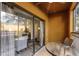 Private screened patio with outdoor seating at 12527 Floridays Resort Dr # E-103, Orlando, FL 32821