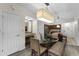 Open concept dining area with glass table and seating at 12527 Floridays Resort Dr # E-103, Orlando, FL 32821