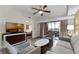 Living room with sofa, chairs, and a view into the bedroom at 12527 Floridays Resort Dr # E-103, Orlando, FL 32821