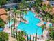 Large community pool with multiple areas for swimming and lounging at 12527 Floridays Resort Dr # E-103, Orlando, FL 32821