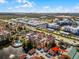 Aerial view of condo building near highway and lake at 12527 Floridays Resort Dr # E-103, Orlando, FL 32821