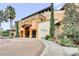 Resort building entrance with landscaping and golf cart at 12527 Floridays Resort Dr # E-103, Orlando, FL 32821