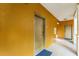 Building hallway with two doors and neutral colored walls at 12527 Floridays Resort Dr # E-103, Orlando, FL 32821