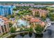 Aerial view of community pool and surrounding buildings at 12527 Floridays Resort Dr # E-103, Orlando, FL 32821