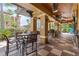 Outdoor patio seating area with tables and chairs at 12527 Floridays Resort Dr # E-103, Orlando, FL 32821