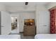 Bright bedroom with two twin beds, dresser, and access to a dining area at 12527 Floridays Resort Dr # E-103, Orlando, FL 32821
