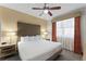 Spacious bedroom with king-size bed and large windows at 12527 Floridays Resort Dr # E-103, Orlando, FL 32821