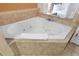 Relax in this corner bathtub with jets at 12527 Floridays Resort Dr # E-103, Orlando, FL 32821