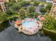 Resort pool with surrounding lounge chairs and gazebo at 12527 Floridays Resort Dr # E-103, Orlando, FL 32821