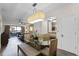 Glass dining table with seating for four in an open-plan setting at 12527 Floridays Resort Dr # E-103, Orlando, FL 32821