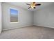 Well-lit bedroom with window and ceiling fan at 2421 Huron Cir, Kissimmee, FL 34746