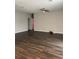 Spacious living area featuring wood-look flooring and a ceiling fan at 221 Elm Ct, Poinciana, FL 34759