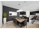 Bright dining room with a wood table and dark gray chairs at 15109 Willow Arbor Cir, Orlando, FL 32824