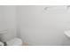 Simple, clean bathroom with white toilet and sink at 15109 Willow Arbor Cir, Orlando, FL 32824