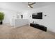 Spacious loft area with a TV and ceiling fan at 15109 Willow Arbor Cir, Orlando, FL 32824