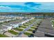 Aerial view of houses with solar panels and community at 15109 Willow Arbor Cir, Orlando, FL 32824