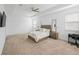 Main bedroom with carpeted floor, TV and a desk at 15109 Willow Arbor Cir, Orlando, FL 32824