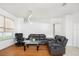 Living room with dark gray reclining sofas and hardwood floors at 2445 Cypress Trace Cir, Orlando, FL 32825