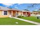 Row of yellow houses with green lawns at 4621 College Dr, Orlando, FL 32811