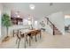 Dining area showcasing a kitchen with dark cabinetry and a breakfast bar at 5249 Villa Rosa Ave, Saint Cloud, FL 34771