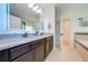 Double vanity bathroom with granite countertop and large mirror at 5249 Villa Rosa Ave, St Cloud, FL 34771