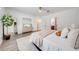 Bright bedroom with a queen-size bed and large mirror at 5249 Villa Rosa Ave, St Cloud, FL 34771