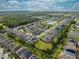 An aerial view of a house in a residential area near a lake at 5249 Villa Rosa Ave, Saint Cloud, FL 34771