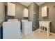 Laundry room with washer, dryer, cabinets, and utility sink at 5249 Villa Rosa Ave, St Cloud, FL 34771