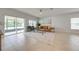 Living area with sliding doors leading to the backyard, featuring a comfortable couch and two armchairs at 5249 Villa Rosa Ave, St Cloud, FL 34771