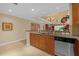 Spacious kitchen with granite countertops and modern cabinetry at 7650 Whisper Way # 203, Reunion, FL 34747